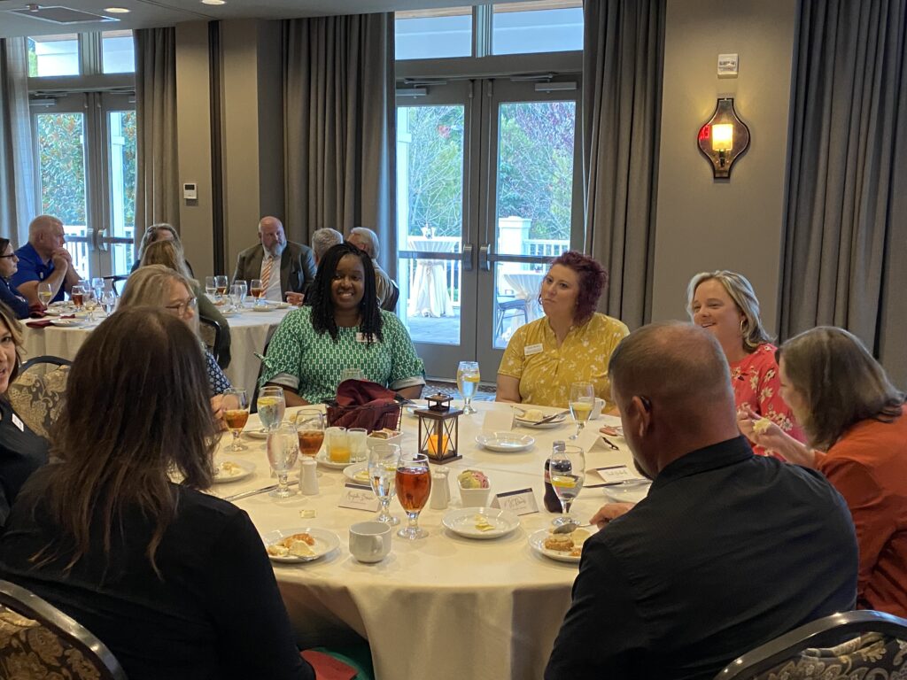 TELA cohort talking at dinner on first night.